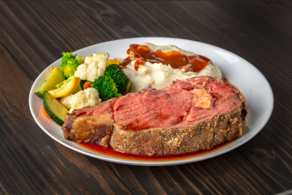 grass-fed prime rib paired with ﻿mashed potatoes and steamed vegetables.