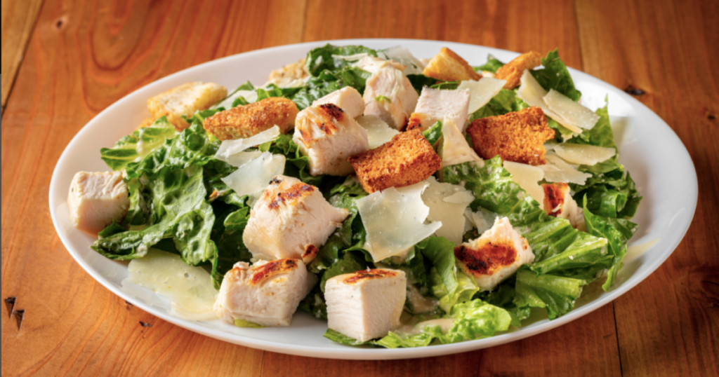 A classic California Caesar Salad with chicken, parmesan, and croutons.